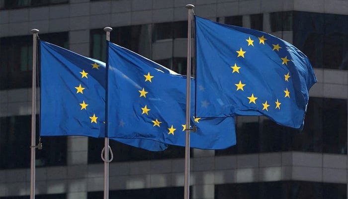European Union flags fly outside the European Commission headquarters in Brussels, Belgium, April 10, 2019. -File