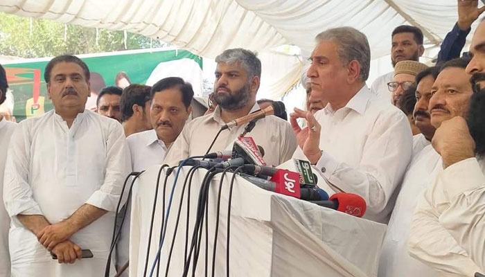PTI leader Shah Mehmood Qureshi, along with his son Zain Qureshi, talking to the media during the election campaign in PP217 on June 28, 2022. Photo: Twitter