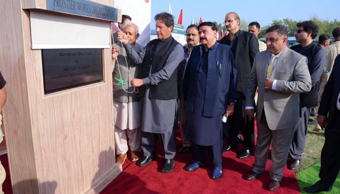 In this photo, ex-PM Imran Khan is seen unveiling the plaque for groundbreaking of the Rawalpindi Ring Road project on March 19, 2022. Photo: APP