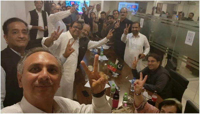 PTI workers celebrating after preliminary, unofficial results show the party securing a landslide victory in the Punjab by-polls, on July 17, 2022. — Photo courtesy Twitter/Omar Ayub