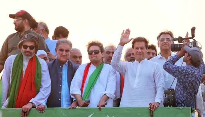 (From Left) PTI leader Ali Muhammad khan, Shah Mehmood Qureshi, Faisal Javed, party chairman Imran Khan and Asad Umer during long March. —PTI Facebook