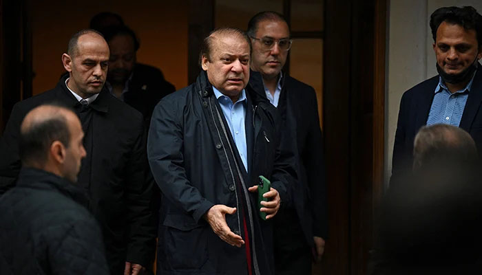 Former prime minister Nawaz Sharif (3L), brother of Pakistans current Prime Minister Shehbaz Sharif, leaves property in west London on May 11, 2022. &mdash; AFP
