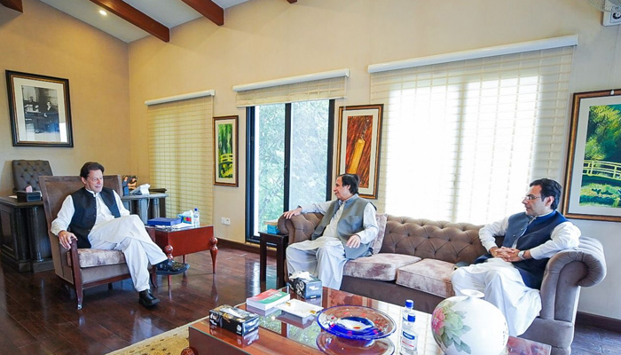 Punjab Chief Minister Pervez Elahi meets former prime minister Imran Khan at his Banigala residence on August 23, 2022. -Courtesy Fawad Chaudhry Twitter