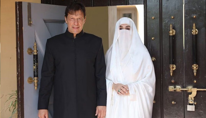 PTI Chairman Imran Khan with his wife Bushra Bibi. Courtesy PTI Twitter