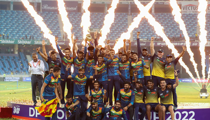 Sri Lanka´s team members celebrate with the trophy at the end of the Asia Cup Twenty20 international cricket final match between Pakistan and Sri Lanka at the Dubai International Cricket Stadium in Dubai on September 11, 2022. —AFP/ SURJEET YADAV