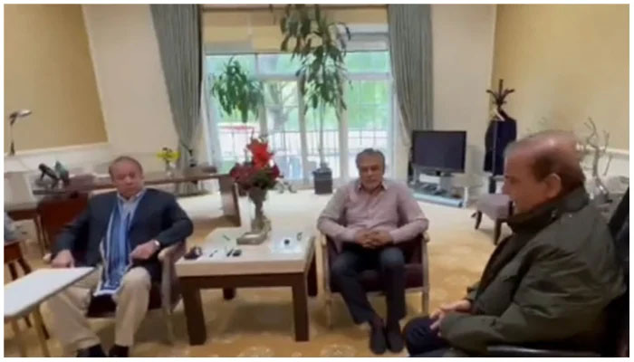 (L to R) PML-N Supremo Nawaz Sharif, senior party leader Ishaq Dar, and Prime Minister Shehbaz Sharif are seen holding a meeting in London, the United Kingdom in this picture. — Screengrab via YouTube/ Geo News Live