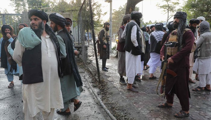 Taliban fighters investigate at a site after a blast near the Wazir Mohammad Akbar Khan Mosque that reportedly happened as people were leaving the mosque after Friday prayers at Wazir Akbar Khan in Kabul on September 23, 2022. —AFP