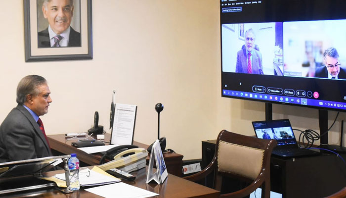 Federal Finance and Revenue Minister Ishaq Dar in a virtual meeting with the International Monetary Fund (IMF) Mission Chief Nathan Porter. PID