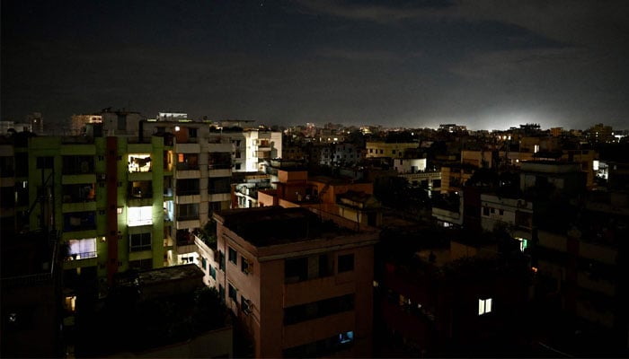 This photograph taken on October 4, 2022 shows a residential neighbourhood during a power blackout in Dhaka. —AFP/ Munir uz zaman