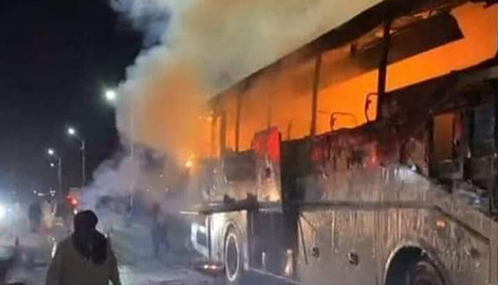 The passenger bus that caught fire on the motorway near Nooriabad, on October 12, 2022. — Twitter