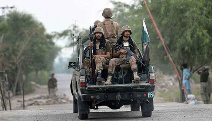 FC personnel aboard a vehicle patrol an area. — AFP/file