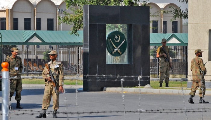 Pakistani soldiers guard the main entrance to the army headquarters in Rawalpindi, Pakistan, in this file photo. — AFP