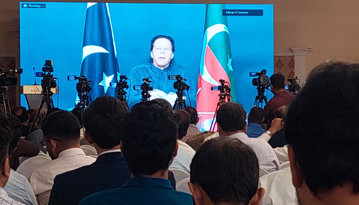 Pakistan Tehreek-i-Insaf Chairman Imran Khan speaking at a seminar at a local hotel in Karachi through a video link. Twitter