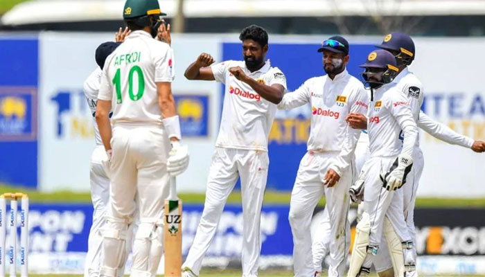 Sri Lankan players celebrate after taking a wicket in Test match against Pakistan. — AFP/File
