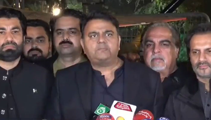 PTI leader Fawad Chaudhry, accompanied by other party leaders, is talking to the media in Lahore on November 28, 2022. Screengrab of a Twitter video.