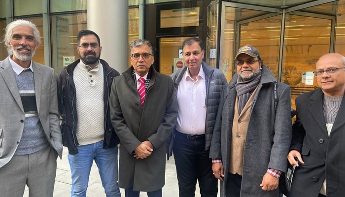 Nadeem Nusrat with his colleagues outside Roll Building of UK High Court, after giving evidence against Altaf Hussain. — provided by the author