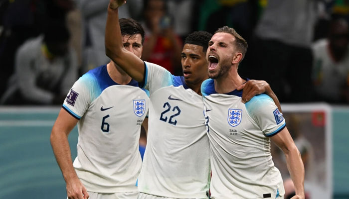 Englands Jordan Henderson celebrates with Jude Bellingham after scoring against Senegal. — AFP/File