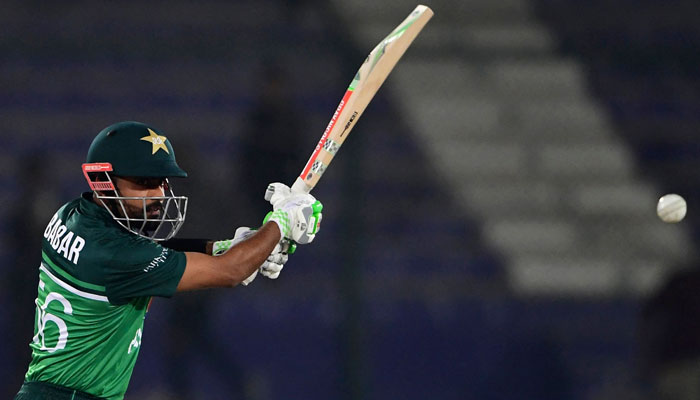 Pakistans captain Babar Azam plays a shot during the first one-day international (ODI) cricket match between Pakistan and New Zealand at the National Stadium in Karachi on January 9, 2023. — AFP
