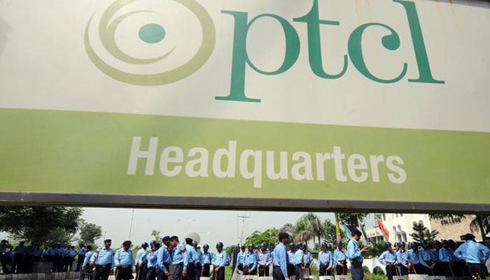 In this file photo, Pakistani police deploy in front of the building of Pakistan Telecommunication Company Limited (PTCL), the largest landline telephone network in Islamabad. — AFP