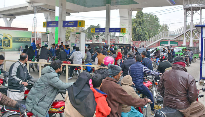 Motorists waiting for their turn to get petrol at a filling station in Rawalpindi on January 29, 2023. Online