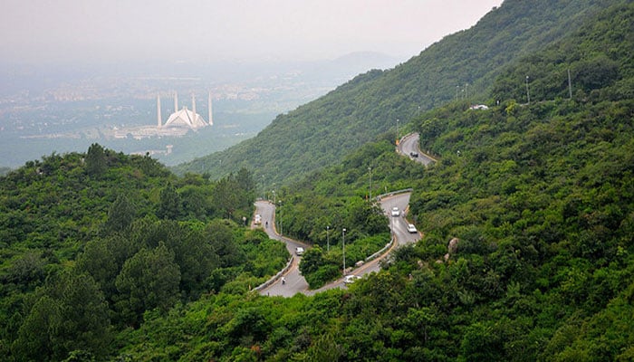 A view of the Margalla Hills with Faisal Mosque in the distance. Since 1980, the Margalla Hills have been a protected and maintained site by the citys Capital Development Authority. — Facebook
