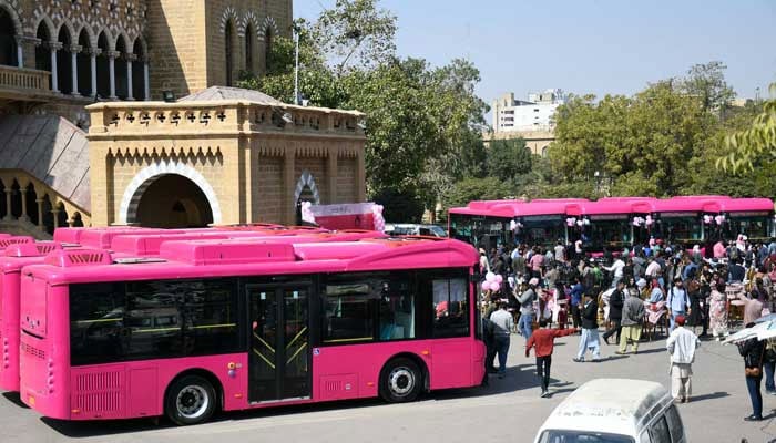 A view of Pink Buses standing near the Frere Hall library in Karachi on February 1, 2023. — Online