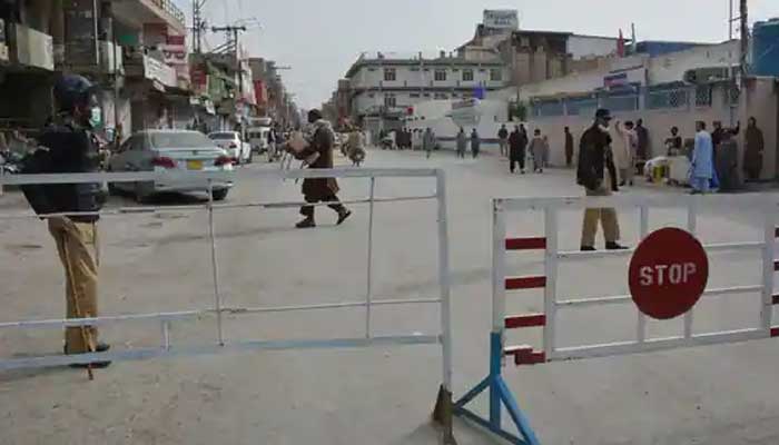 An undated photo of a blocked street guarded by policemen in Pakistan. — AFP/File