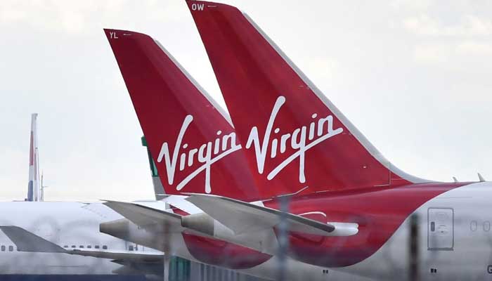 Tails of two Virgin Atlantic jets parked at an airport are seen in this undated photo. — AFP/File