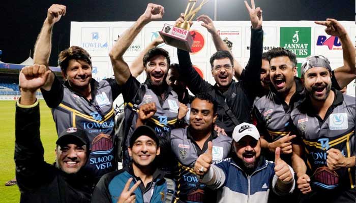 Pakistan Showbiz XI players posing for a picture amid celebration of their win at Sharjah Cricket Stadium. — Provided by author