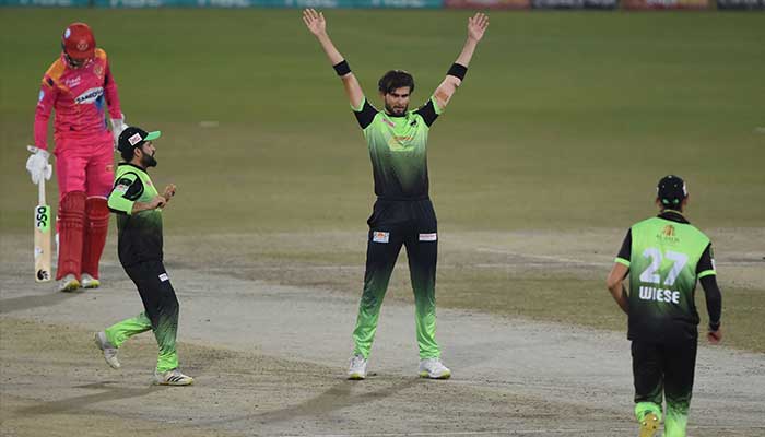 Lahore Qalandars´ Shaheen Afridi celebrates the wicket of unseen Islamabad United Paul Stirling during the Pakistan Super League (PSL) Twenty20 eliminator 2 cricket match between Lahore Qalandars and Islamabad United at the Gaddafi Cricket Stadium in Lahore on February 25, 2022. — AFP