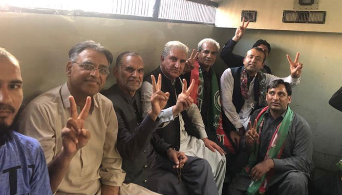 PTI leaders photographed while surrendering to police in partys Jail Bharo movement. Twitter/ShireenMazari1