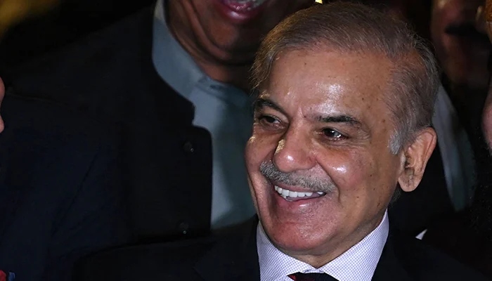 Prime Minister Shehbaz Sharif laughs during a press conference in Islamabad on April 7, 2022. — AFP
