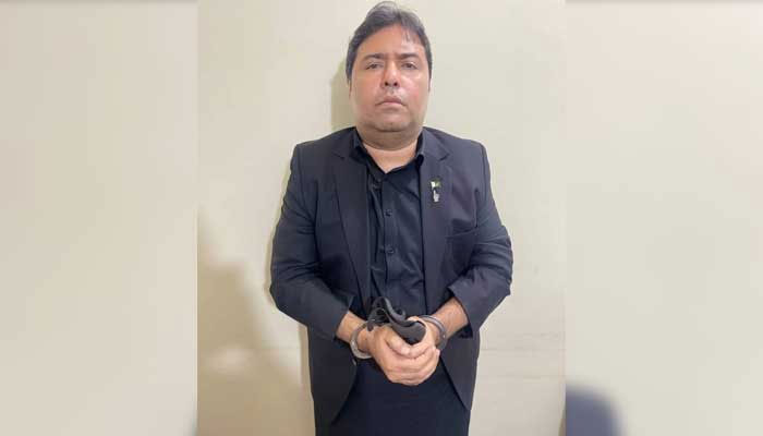 Shoaib Shaikh, the chief executive officer of Axact and owner of a private television channel, seen arrested in this photo. — Geo News