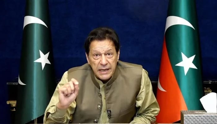PTI Chairman Imran Khan addresses workers and supporters via video link from Lahore on March 19, 2023, in this still taken from a video. — YouTube/PTI