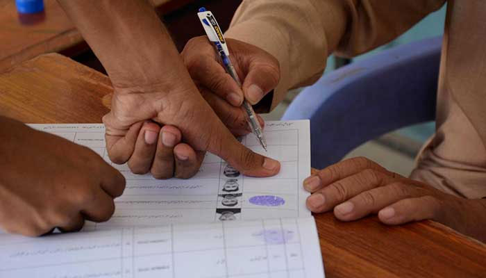 A person casting vote during by-election at NA-108 Constituency in Faisalabad, on October 16,. 2022. — APP