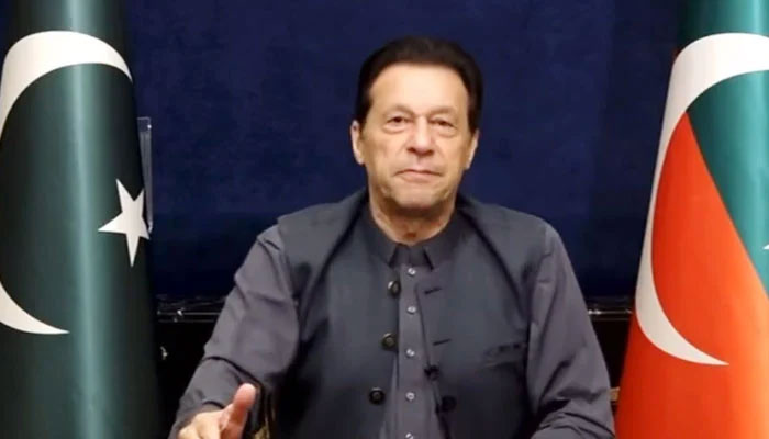 Pakistan Tehreek-e-Insaf Chairman Imran Khan addresses his workers and supporters via video link on March 20, in this still taken from a video. — Twitter/@PTIofficial