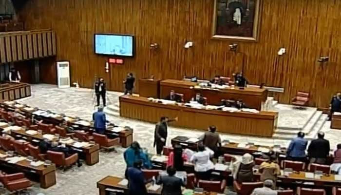 PTI members seen protesting against incarceration of Senator Azam Sawti while the Upper House approves Foreign Investment (Promotion and Protection) Bill, 2022. — Screengrab/YouTube/PTV Parliament/file
