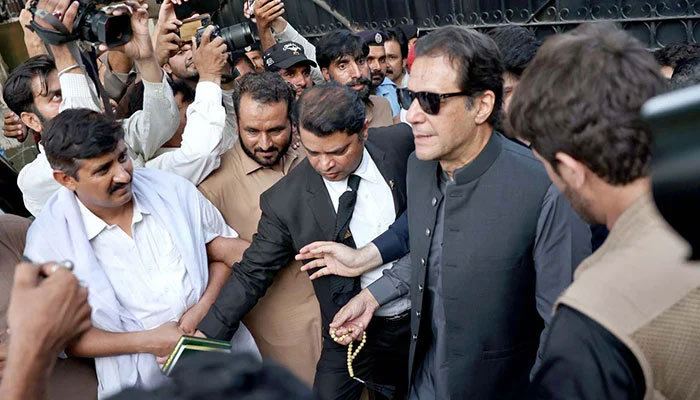 Former Prime Minister and Chairman PTI Imran Khan leaving an Islamabad court after a hearing. — APP/File