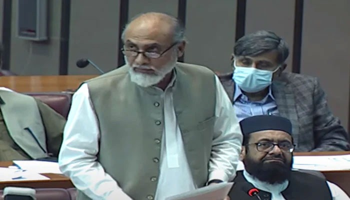 Balcohsitan Awami Party lawmaker Khalid Magsi reading out the resolution in the National Assembly before its approval. — Screengrab/PTV News