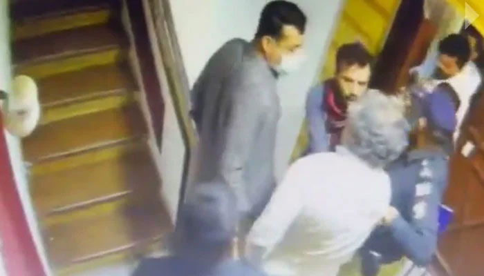 Police take PTI leader Ali Zaidi into custody in Karachi, on April 15, 2023, in this still taken from a video. — Twitter/PTIofficial