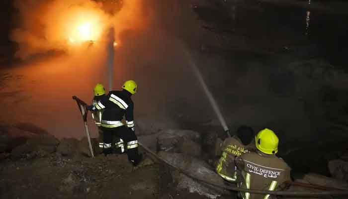 Image shows firefighters battling a flame at the Abu Dhabi marina on March 7, 2016. — United Arab Emirates News Agency