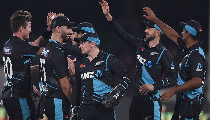 New Zealand´s cricketers celebrate after the dismissal of Pakistan´s captain Babar Azam (not pictured) during the third Twenty20 international cricket match between Pakistan and New Zealand at the Gaddafi Cricket Stadium in Lahore on April 17, 2023. —AFP