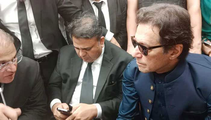 PTI Chairman Imran Khan talking to his lawyer after his arrival at Lahore High Court on April 17, 2023. — Twitter/@PTIofficial