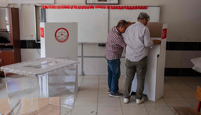 Teachers prepare ballot boxes and cardboard voting booths at a school in Antakya, on May 13, 2023, where voting will take place in presidential and legislative elections on May 14, which could end President Recep Tayyip Erdogan´s 21-year rule.—AFP