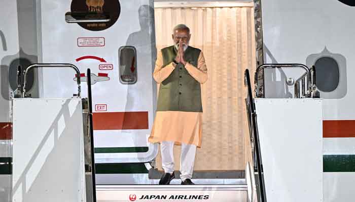 This handout photo taken and released by the Ministry of Foreign Affairs of Japan shows Indias Prime Minister Narendra Modi arriving for the G7 Leaders Summit at Hiroshima airport in Mihara, Hiroshima prefecture on May 19, 2023. —AFP