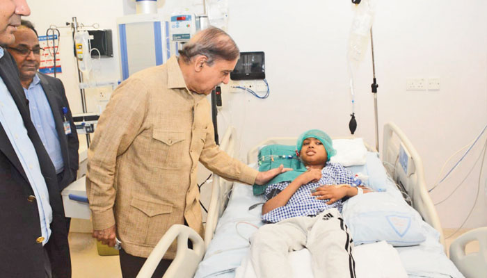 LAHORE: Prime Minister Shehbaz Sharif met a patient during his visit to the Pakistan Kidney and Liver Institute, Saturday.—The News