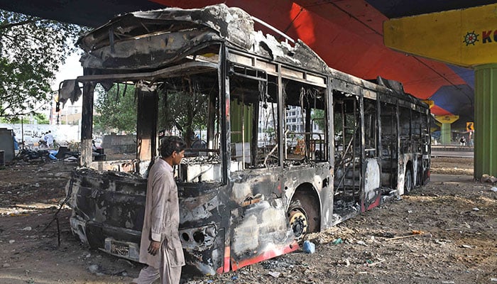 A view of the burnt buses on roads of the Financial Capital, as a handful of protesters of PTI destroyed public properties and committed a huge loss to the country, after a protest against the arrest of Former Prime Minister Imran Khan. —ONLINE