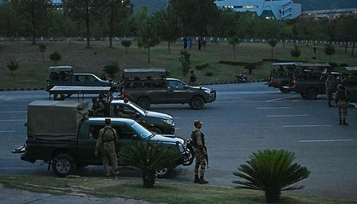 Army troops stand guard in the red zone after the arrest of former prime minister Imran Khan triggered violent protests by his supporters, in Islamabad on May 11, 2023. — AFP