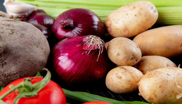 Close up view of vegetables as beetroot onion potato tomato and others. Freepik