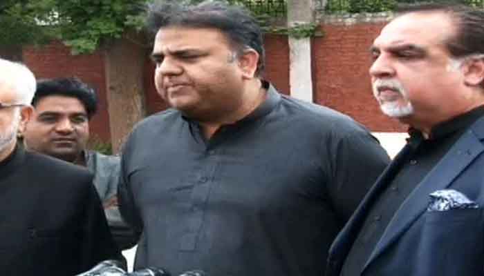 Former Pakistan Tehreek-e-Insaf leader Fawad Chaudhry (centre) addresses a press conference alongside ex-governor Sindh Imran Ismail outside Adiala jail on May 31, in this still taken from a video. — YouTube/Geo News/Live